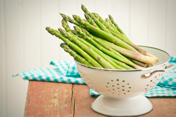 green asparagus in colander