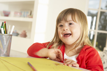 Girl with Downs Syndrome drawing