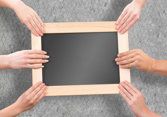 Hands holding frame