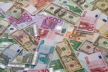 Obraz na płótnie Canvas Background of dollars, euros and rubles