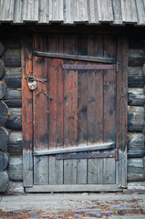 Old wooden door with metallic doorlock