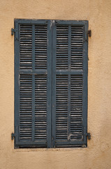 Old Windows and Yellow walls in Villefranche Town in France