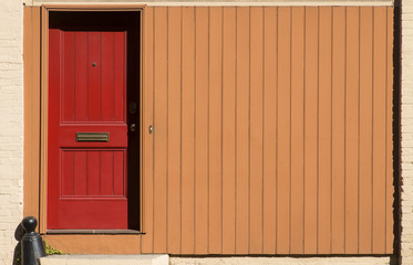 Obraz na płótnie Canvas Red Door - Orange Wall