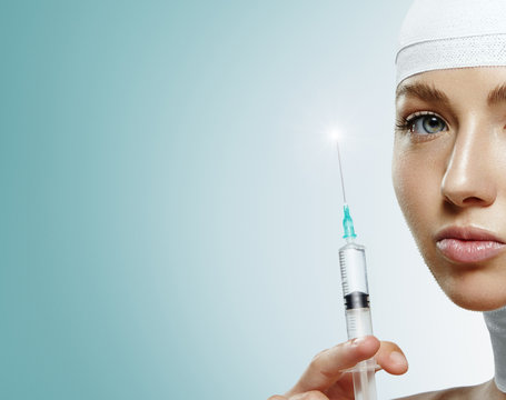 Portrait of woman with syringe injection