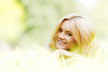 Fototapeta premium Young woman on grass