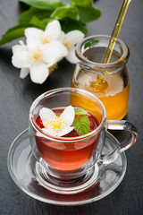 Herbal tea with mint, jasmine flowers and honey.