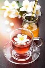 Herbal tea with jasmine flowers and honey