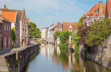 Fototapeta na wymiar Bruges - Canal and Gouden Hadstraat street in morning light.