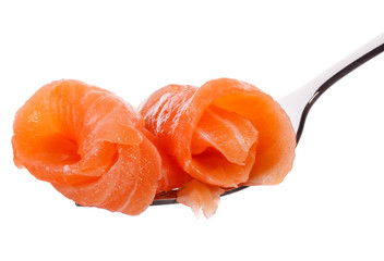 Salmon piece on fork isolated on white background cutout