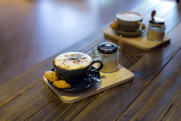 Coffee in cup and cookies in coffee cafe