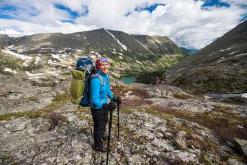 Hiker is posing in Altai mountains, russia