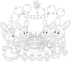 Obraz na płótnie Canvas Family of rabbits at the holiday table