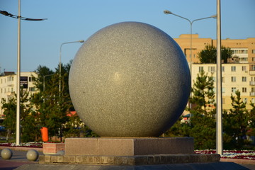 Stone sphere as a street decoration