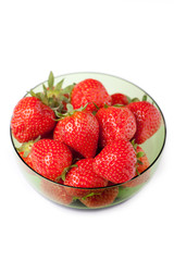 Bowl of fresh strawberries on white background