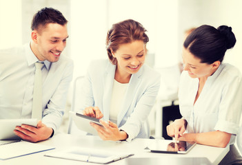 business team working with tablet pcs in office