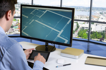 Designer working on tablet in office