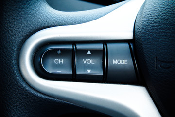 Audio Control Buttons on Steering Wheel of Modern Car