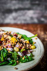 Healthy salad with spinach,quinoa and roasted vegetables