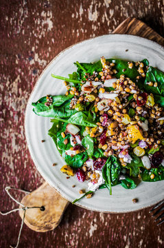 Healthy salad with spinach,quinoa and roasted vegetables
