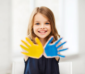 girl showing painted hands