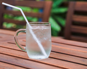 water in a glass on wooden