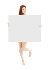 Beautiful young sexy woman holding a empty white board