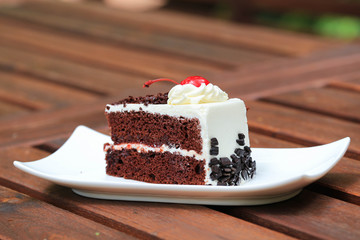 Cheesecake with Chocolate Sauce and Cherries