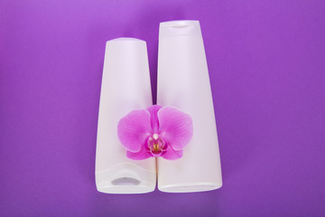 Cosmetics set for bathing, with an orchid flower