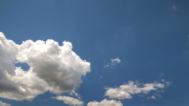 Cumulus clouds moving in the sky