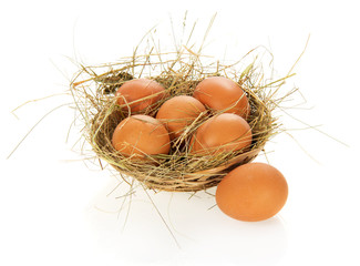 Eggs, hay in a bast basket