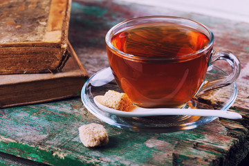 Cup of fresh herbal tea  on vintage background.