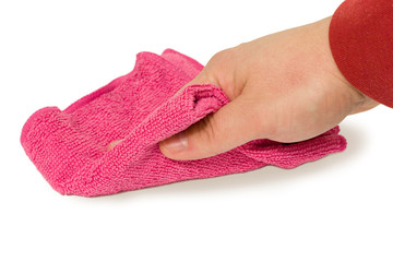 Hand holding a magenta sponge and wipe dust