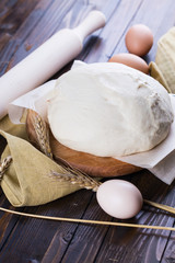 Dough on wooden board