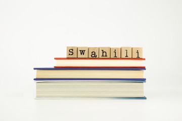 swahili language word on wood stamps and books