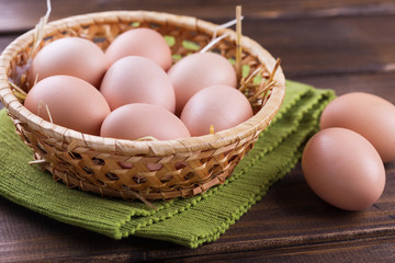 Chicken eggs on wooden background