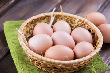 Chicken eggs on wooden background