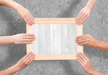 Hands holding frame