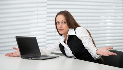 Pretty secretary sitting at desk