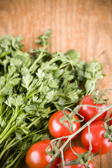 sweet little red tomatos with green parsley