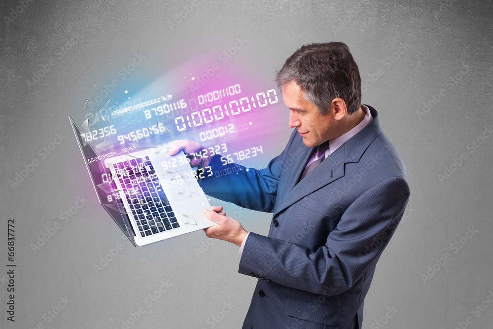 Wall mural Businessman holding notebook with exploding data and numbers