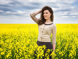 girl portrait in yellow flower field