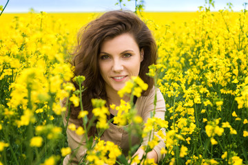 woman portrait in yellow flower field