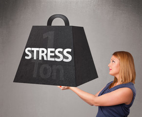 Young woman holding one ton of stress weight