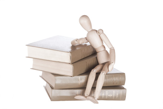 Wooden Dummy Sits On Books