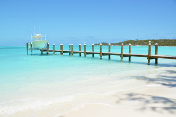 Yacht at the wooden jetty. Exuma, Bahamas