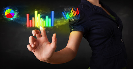 Young businesswoman touching colorful modern graph system concep