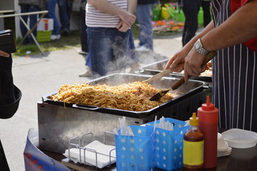 Man cooking noodles