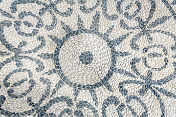 Ornament aus Kieselsteinen als Hintergrund