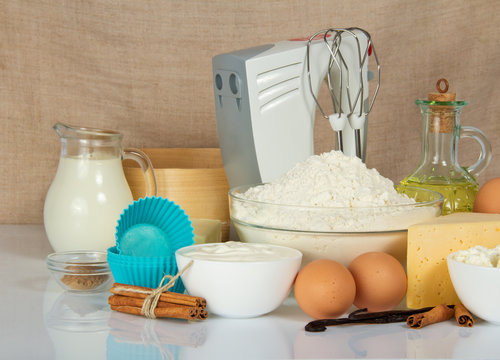 Mixer, cake pan, spices, eggs and dairy products