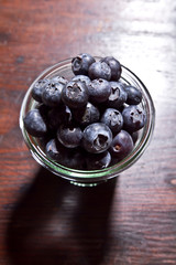 bowl of blueberries on rustic wooden table